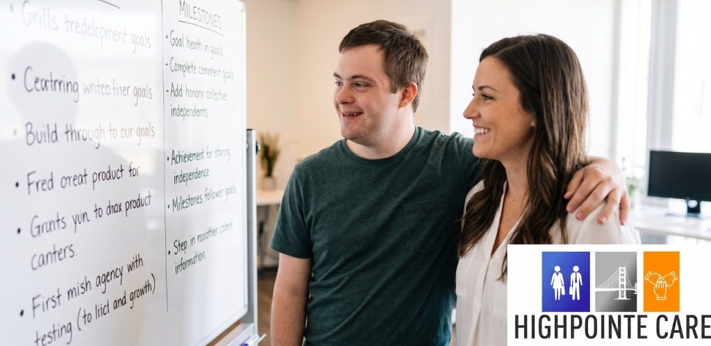 Job developer and participant celebrating workplace milestones on whiteboard