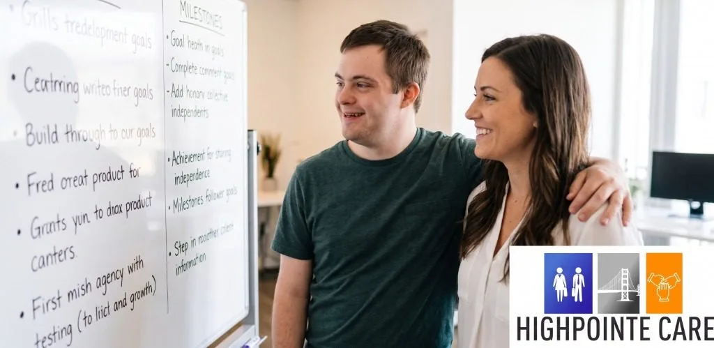 Job developer and participant celebrating workplace milestones on whiteboard